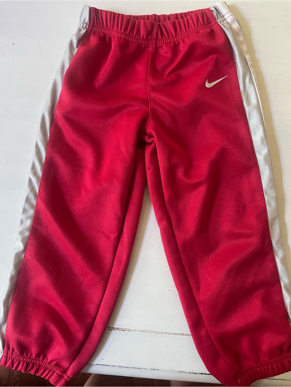 Nike Kids Red Track Pants with White Side Panels